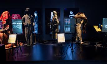 Two costumes added for Los Angeles are visible here: Charlie Chaplin's The Tramp (1914) and Angel (1937) (AMPAS). Hollywood Costume, Gallery 1